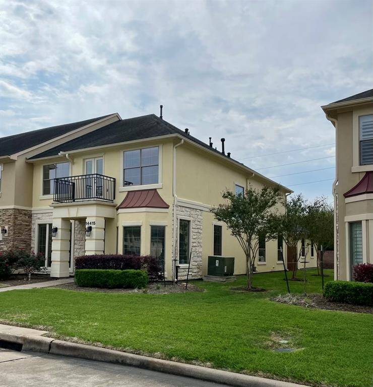 Charming corner lot with a bay window, offering privacy and a cozy patio for relaxing.