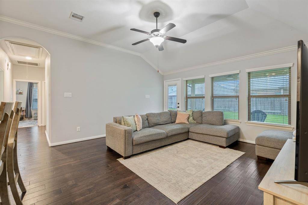 Floor to ceiling windows in living room offers plenty of natural light