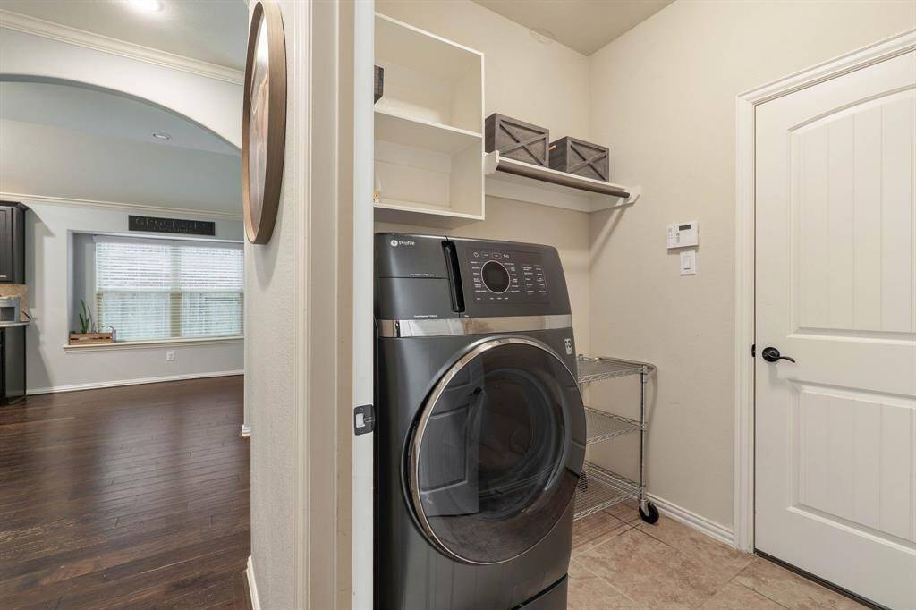 In home spacious laundry room with access to garage. Existing Washer & Dryer will be removed from property and replaced.
