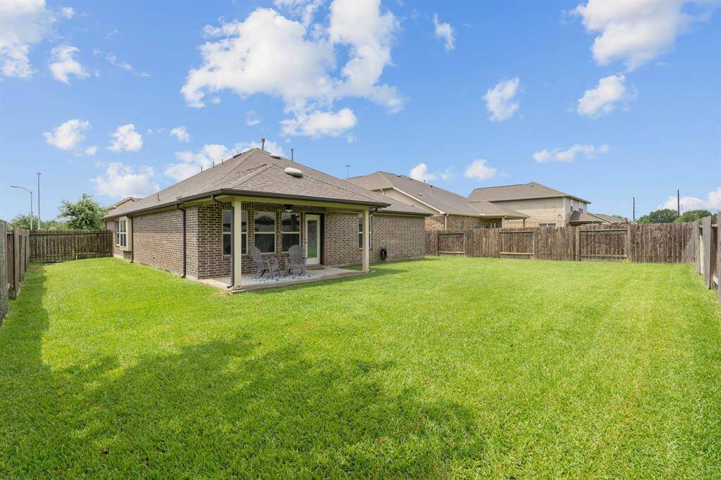 Private, fully fenced backyard with sprinkler system and lots of opportunity for fun!