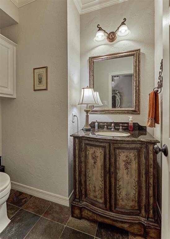 This half bathroom is conveniently located for family and guests.