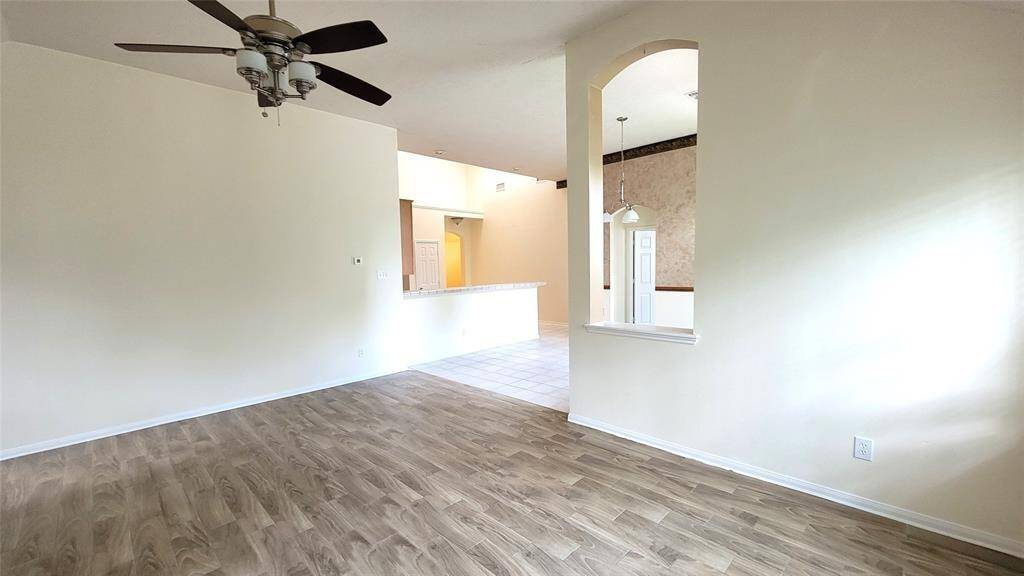 Functional and open kitchen equipped with ample cabinet storage, laminate countertops, and a full appliance suite. The layout flows effortlessly into the dining area, creating a comfortable space for daily meals or entertaining.