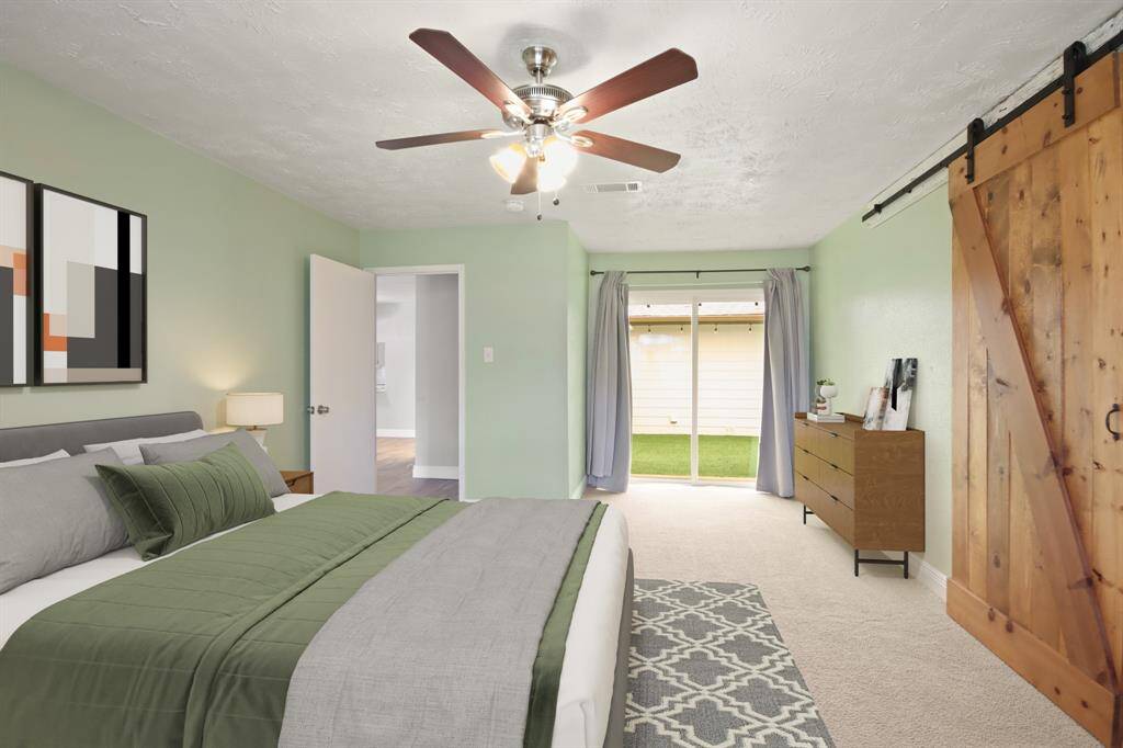Virtually Staged: Plenty of space in this primary suite with access to the courtyard.