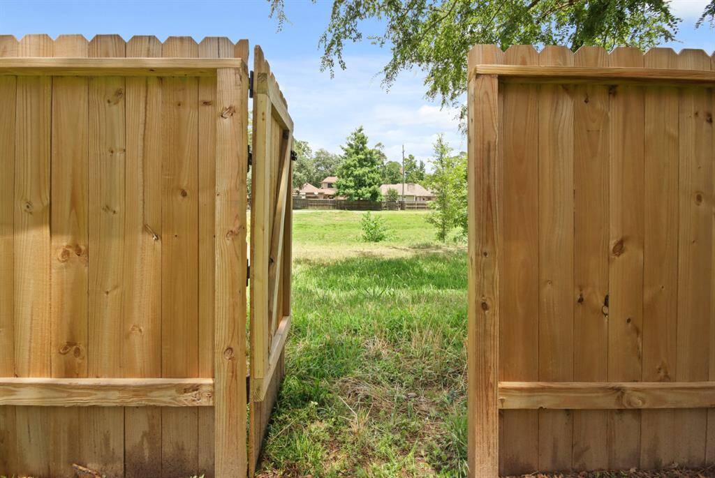 Enjoy the privacy and beauty of a premium lot with no back neighbors and open land stretching beyond the fence to the walking trails.