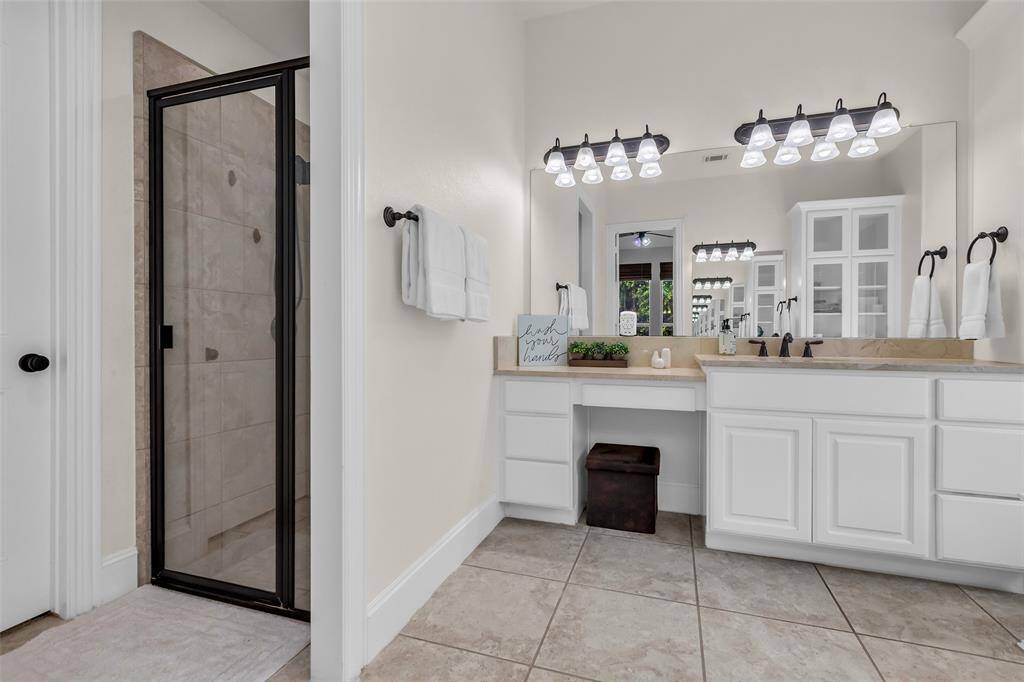 Primary bathroom with double vanities and seperate shower