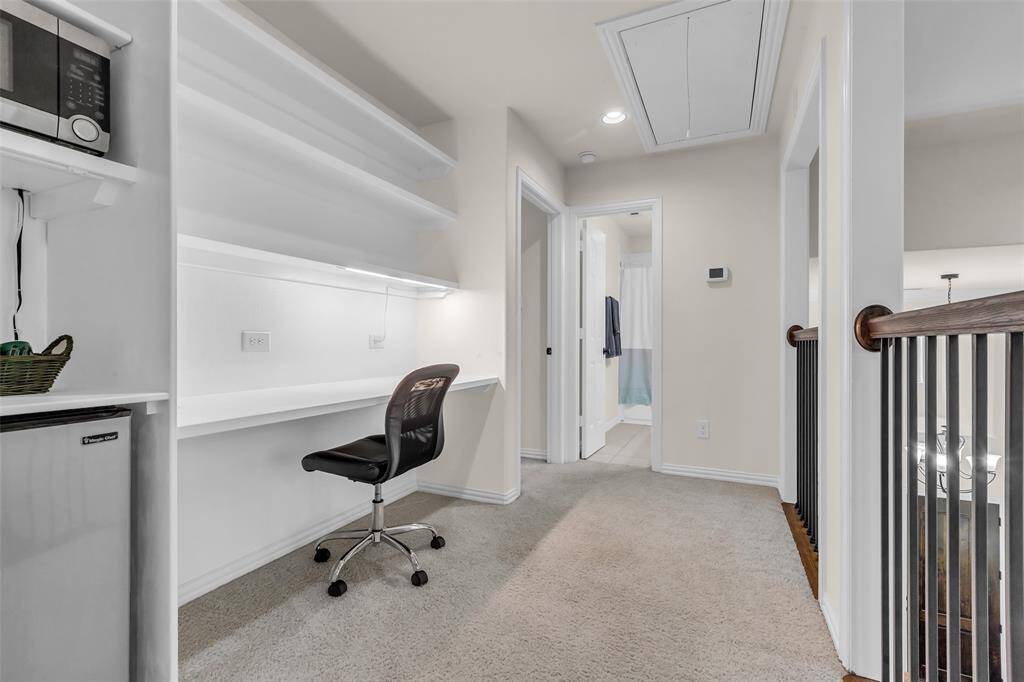 Second floor built in study/desk area with mini fridge and microwave
