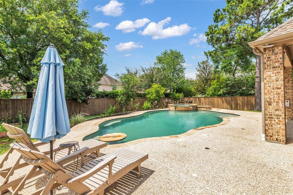 Saltwater pool with cocktail table, spa and deck large enough for several loungers