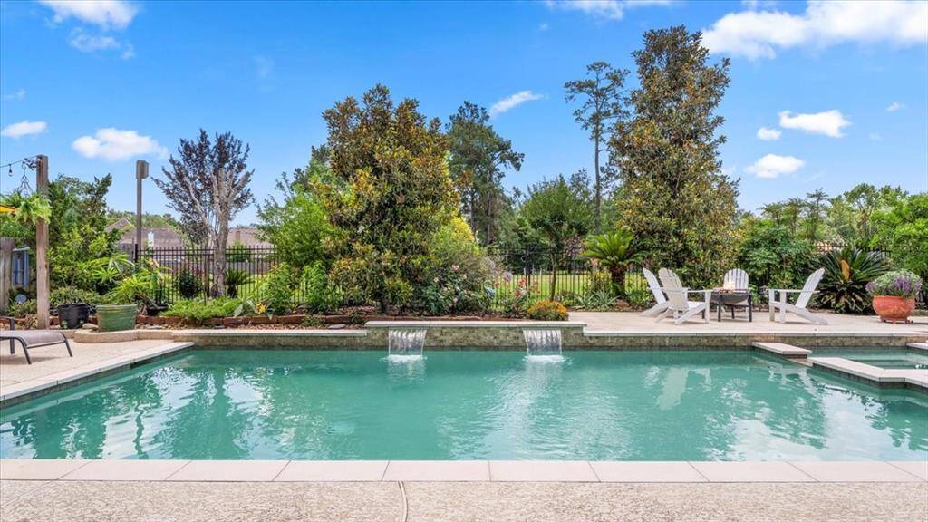 This elegant parlor has large windows with beautiful views of the garden. The room is bright and inviting, perfect for entertaining or relaxing.