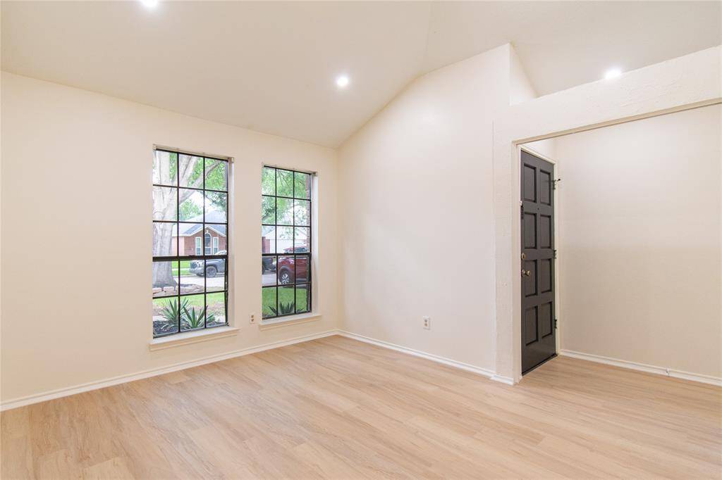 Bright and inviting dining area with large windows and elegant flooring, perfect for entertaining.