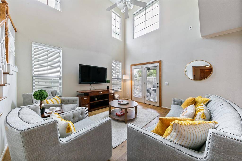 Soaring ceilings. Doors open up to the backyard and covered patio.