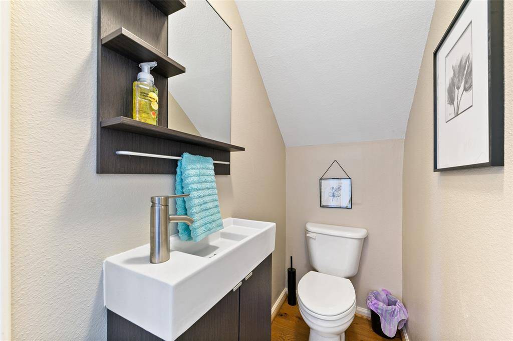 Half bath located under the stairs downstairs.