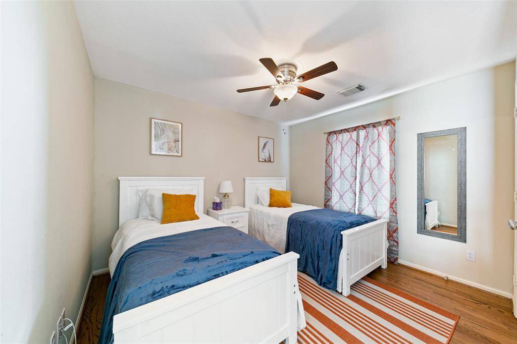 Secondary bedroom upstairs includes two twin beds.