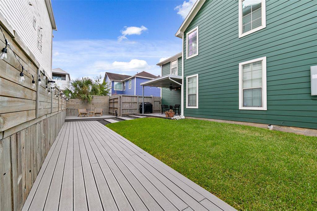 Tons of deck and grass areas. Grill and all patio furniture included. Even the string lights stay :)