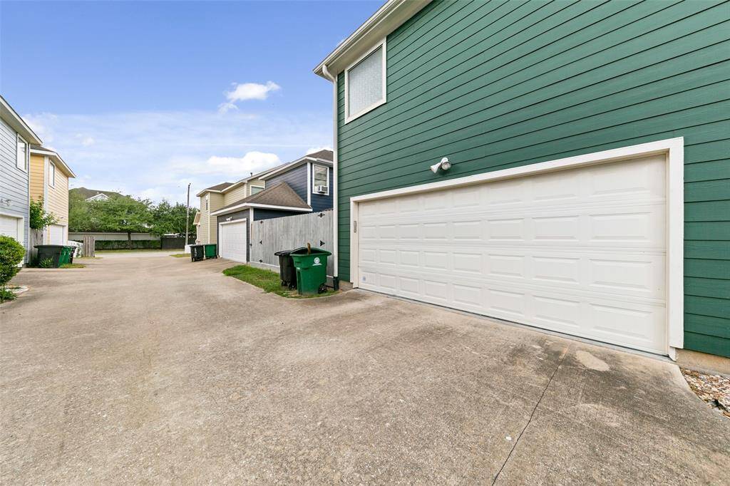 Shared driveway around the back of the home leads to your two car garage. One additional parking space located in the back as well.