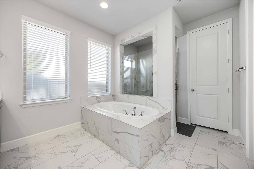 Soaking tub and shower in primary!