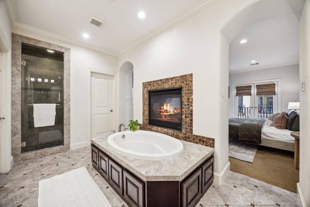 First floor bedroom w/ ensuite bath and access to the private yard.