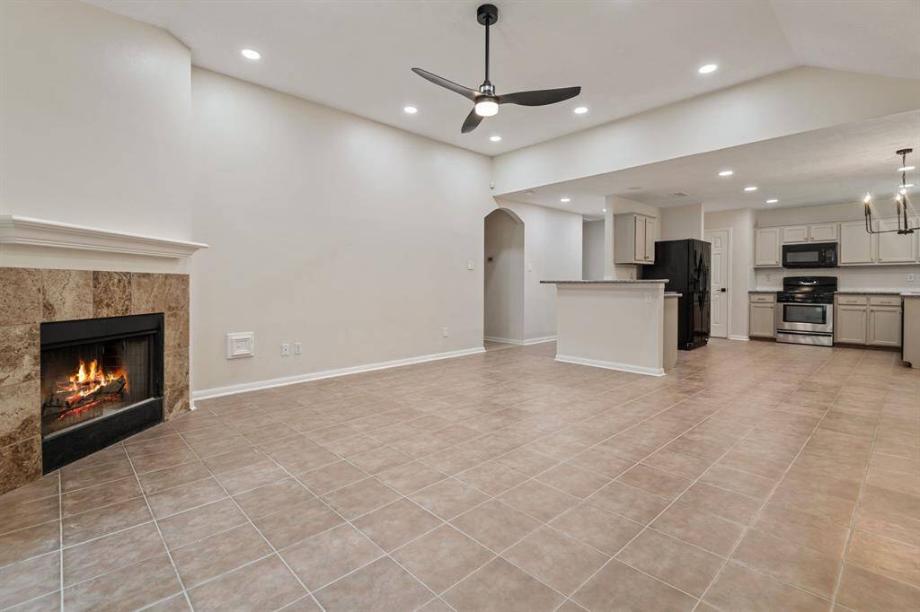 Spacious Living Room with a fireplace centerpiece