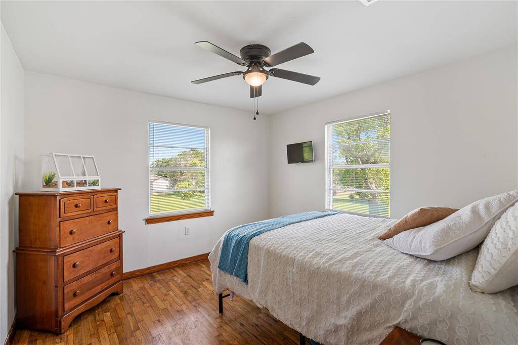 Bright and airy primary bedroom on the second floor, featuring serene views and ample natural light.
