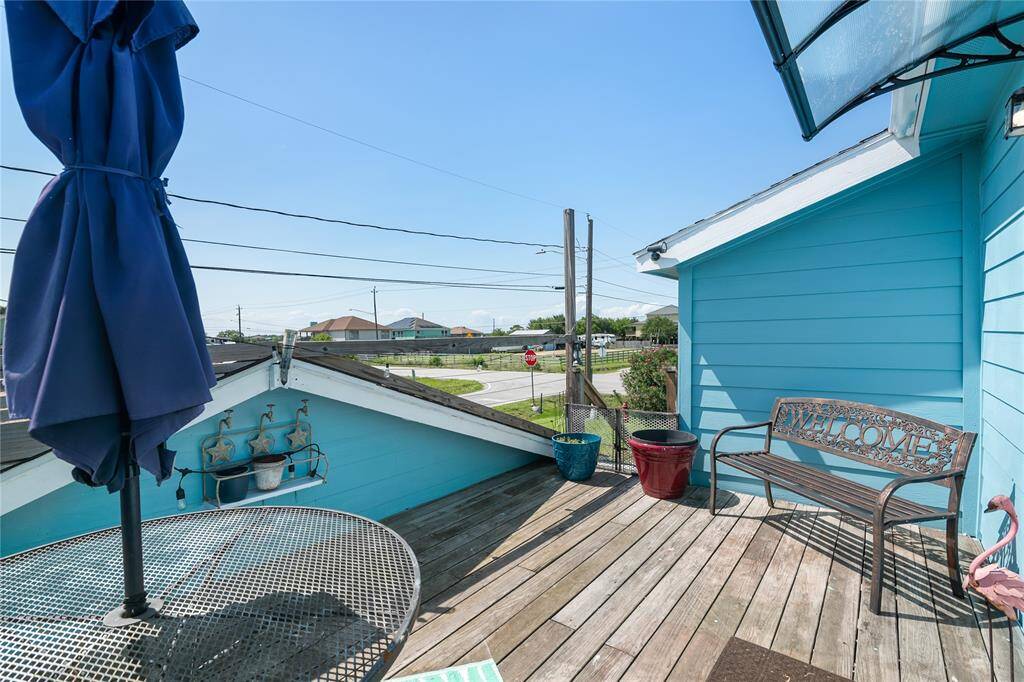 Experience serene water views from the charming upstairs patio deck.