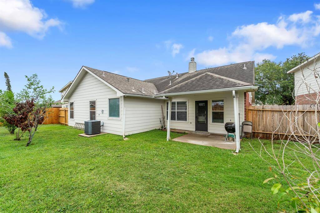 Back yard with covered patio.