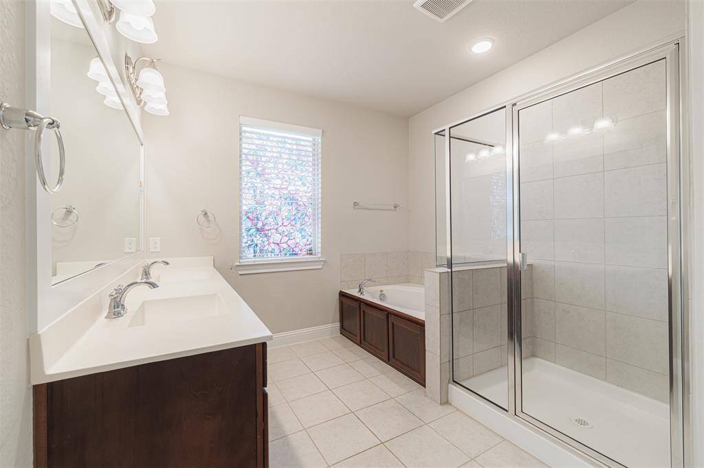 Master Bathroom with Jetted Tub, Double Vanity, and Standing Shower for the Ultimate Retreat.
