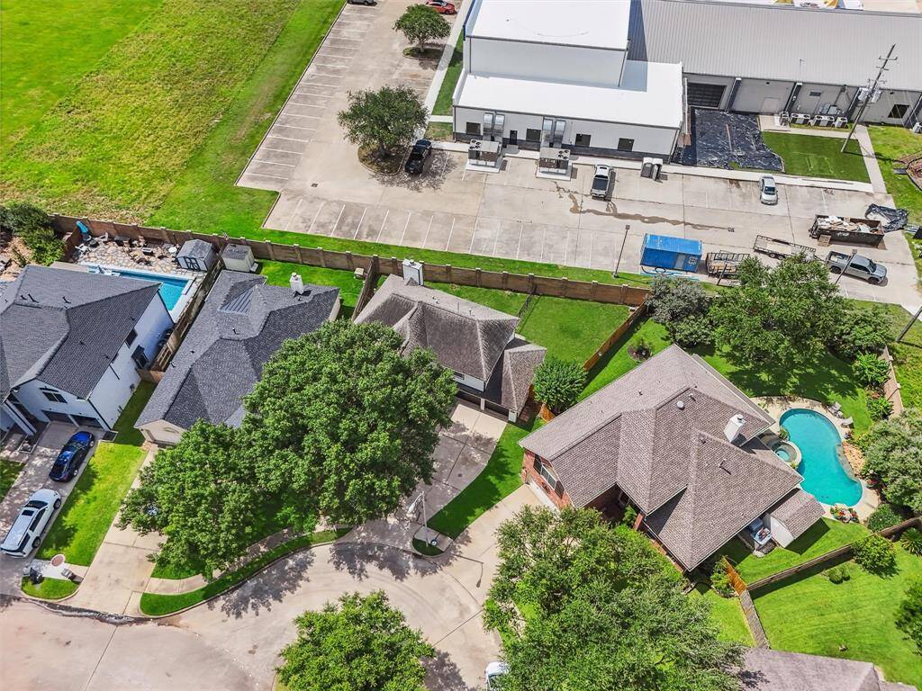 Aerial view reveals this beautiful two-story home tucked into a quiet cul-de-sac within a secure, gated community—offering privacy, safety, and peace of mind.