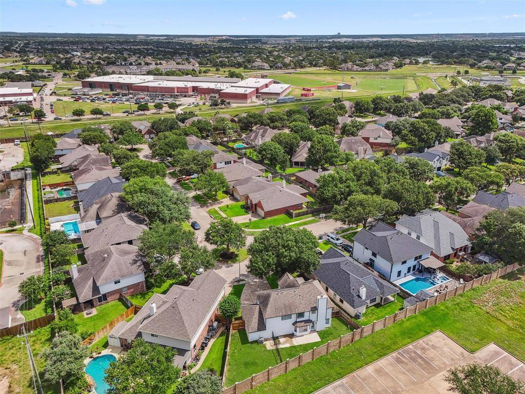 From above, you’ll appreciate the home’s ideal placement in a low-traffic cul-de-sac surrounded by other well-kept properties in a safe, gated environment.