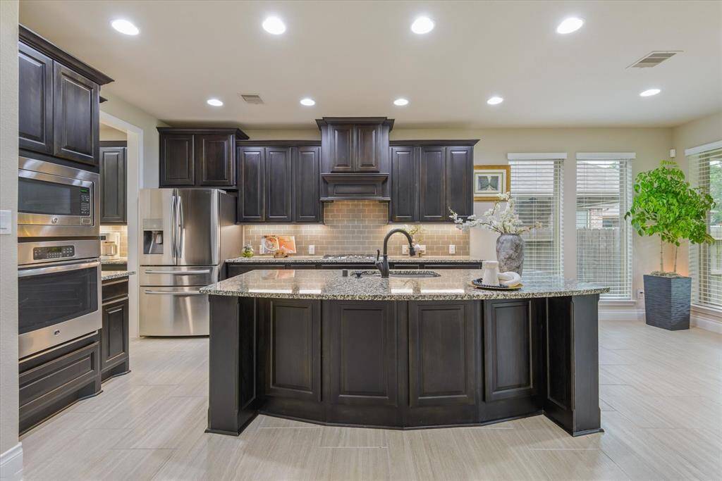 Modern kitchen with a spacious island, perfect for cooking, dining, and gathering with family and friends.