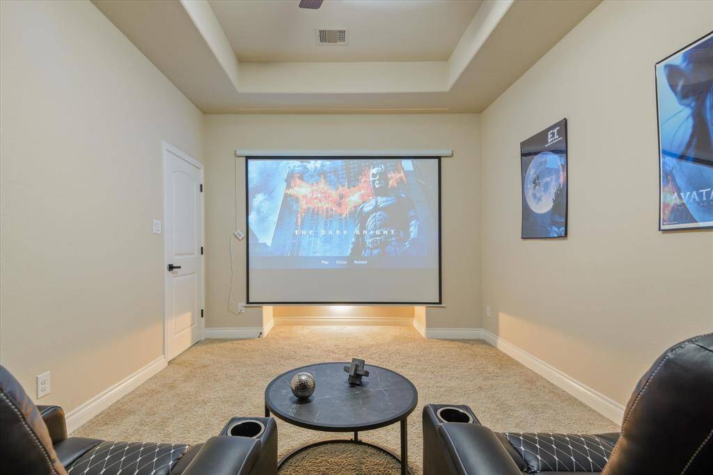 Cozy media room with ample space to add a large screen and projector for the ultimate home theater experience.