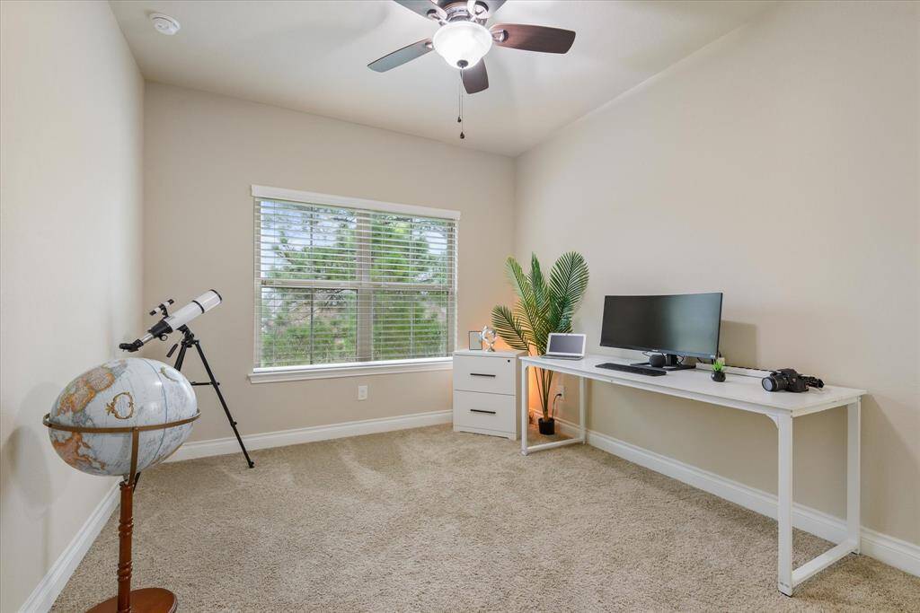 Bedroom 4 - Inviting bedroom with large window, neutral colors, and ample closet space—ideal for guests or a home office.