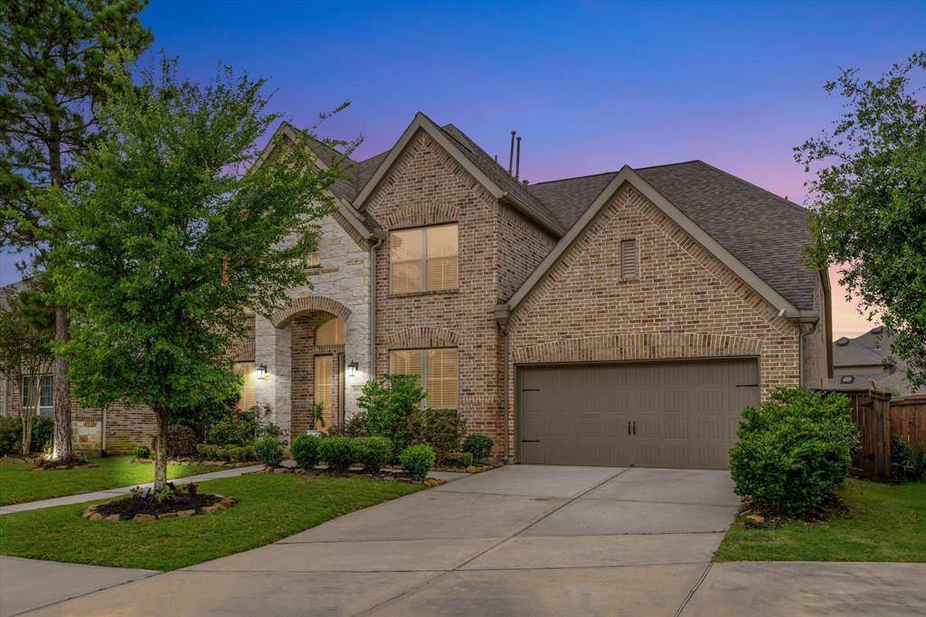 Evening light captures the home’s inviting curb appeal and peaceful setting—come see how great it looks as the sun goes down!