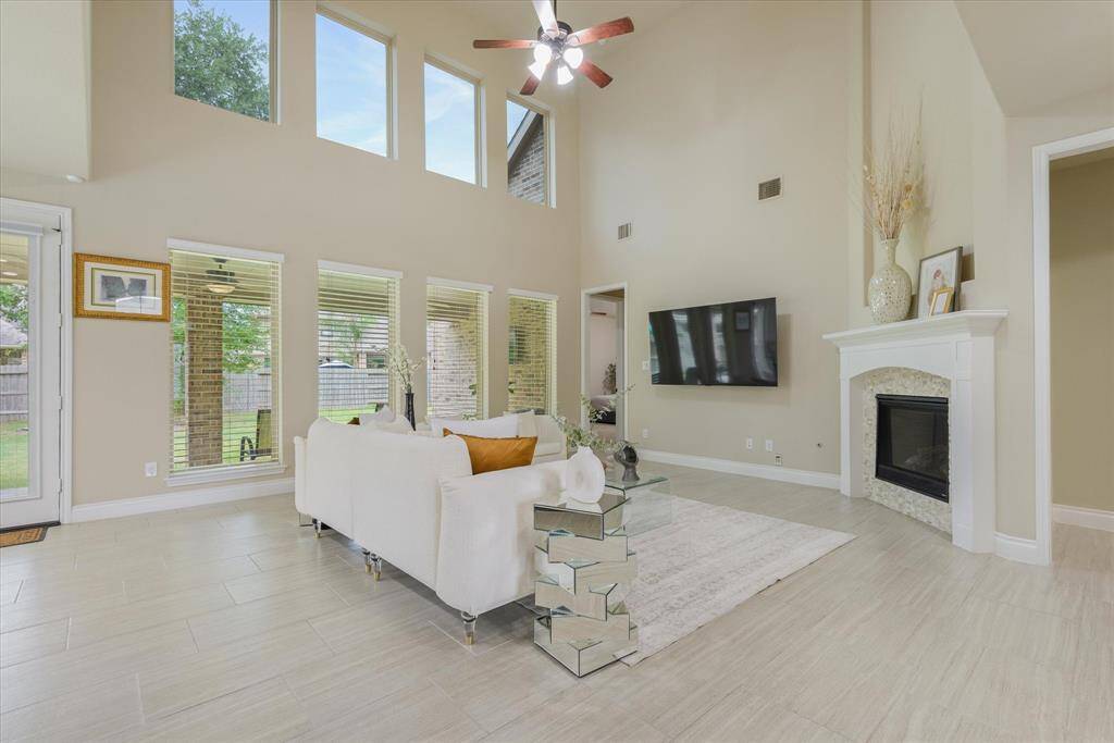 Spacious living room bathed in natural light—perfect for relaxing or entertaining friends and family.