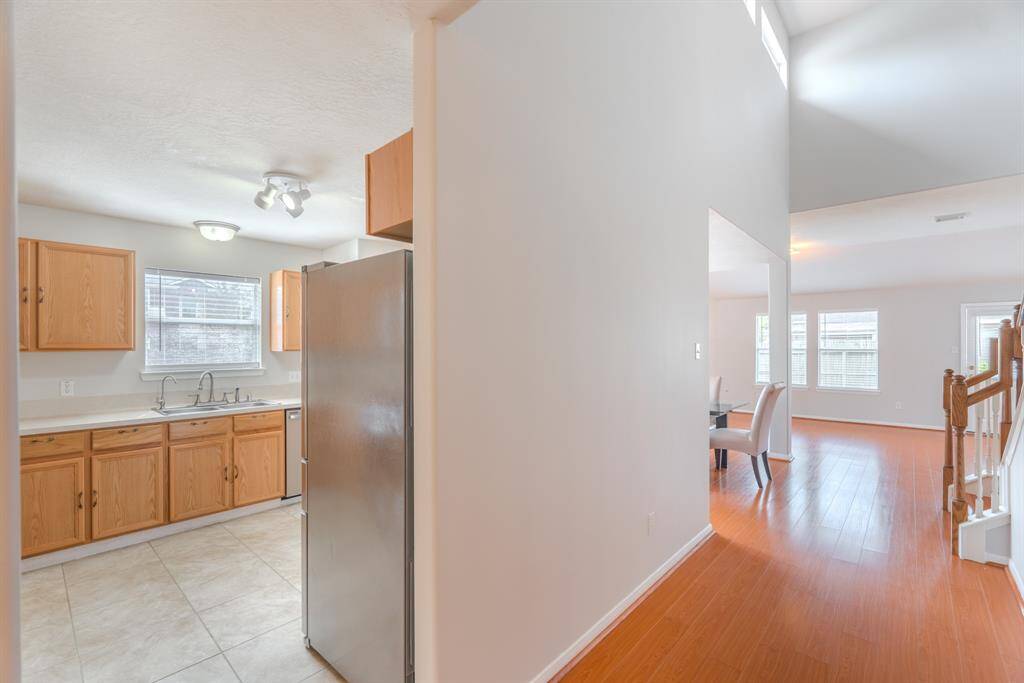 Past the formal dining room, the kitchen sits to your left.