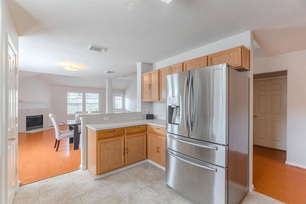 The Kitchen offers plenty of storage, stainless steel appliances, and a seamless connection to the main living area
