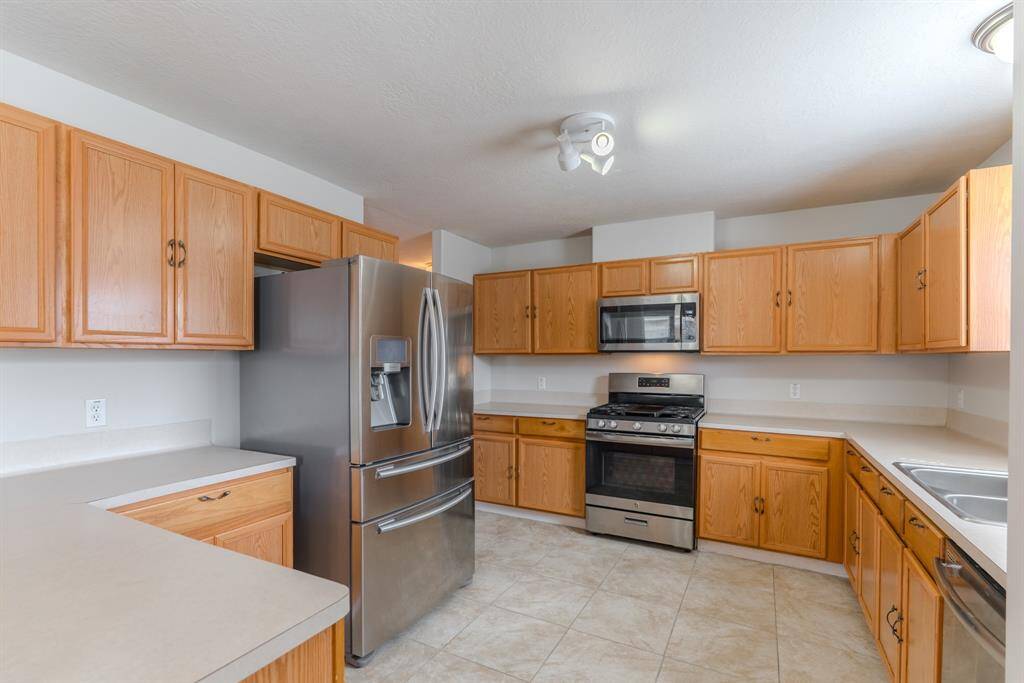 The Kitchen offers plenty of storage, stainless steel appliances, and a seamless connection to the main living area
