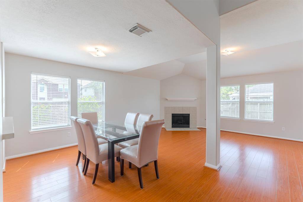 The kitchen opens to a spacious and inviting breakfast area, perfect for casual meals.