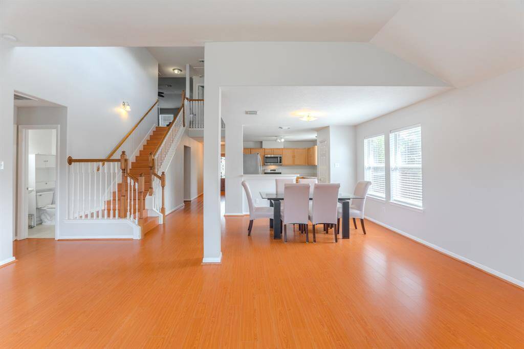The spacious living area is filled with natural light and features a cozy fireplace for those colder winter days.
