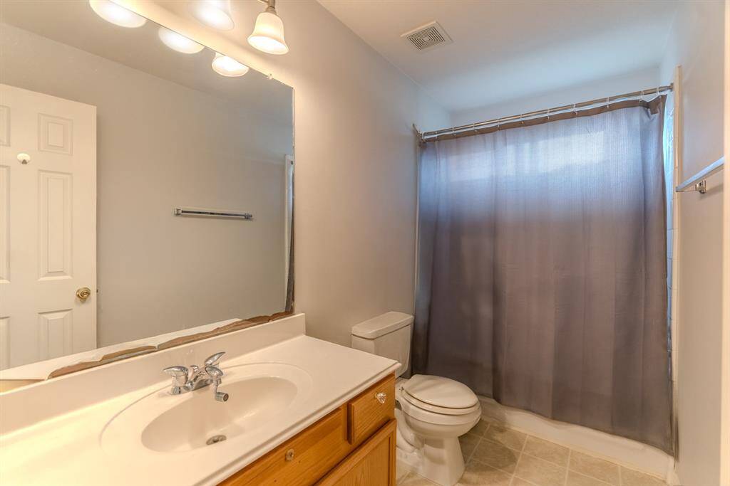 The upstairs full bathroom features a tub-shower combo, offering comfort and convenience for family or guests.