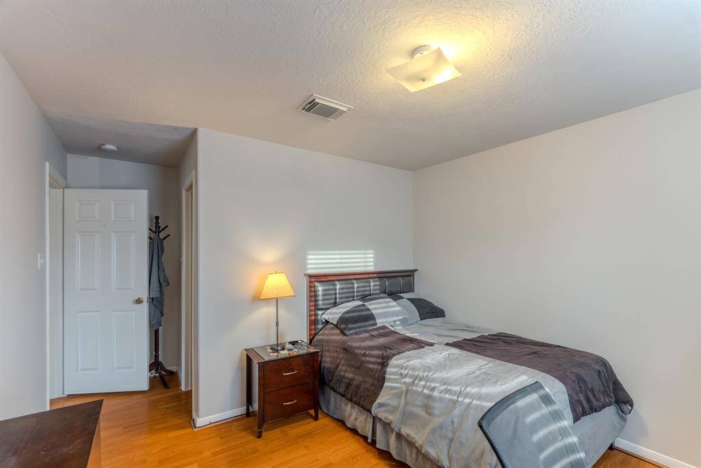 Secondary bedroom is spacious, filled with natural light, and offers plenty of closet space