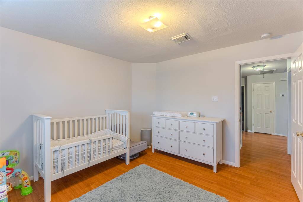 The third bedroom is cozy and bright, offering ample closet space and versatility for use as a bedroom, office, or personal retreat.