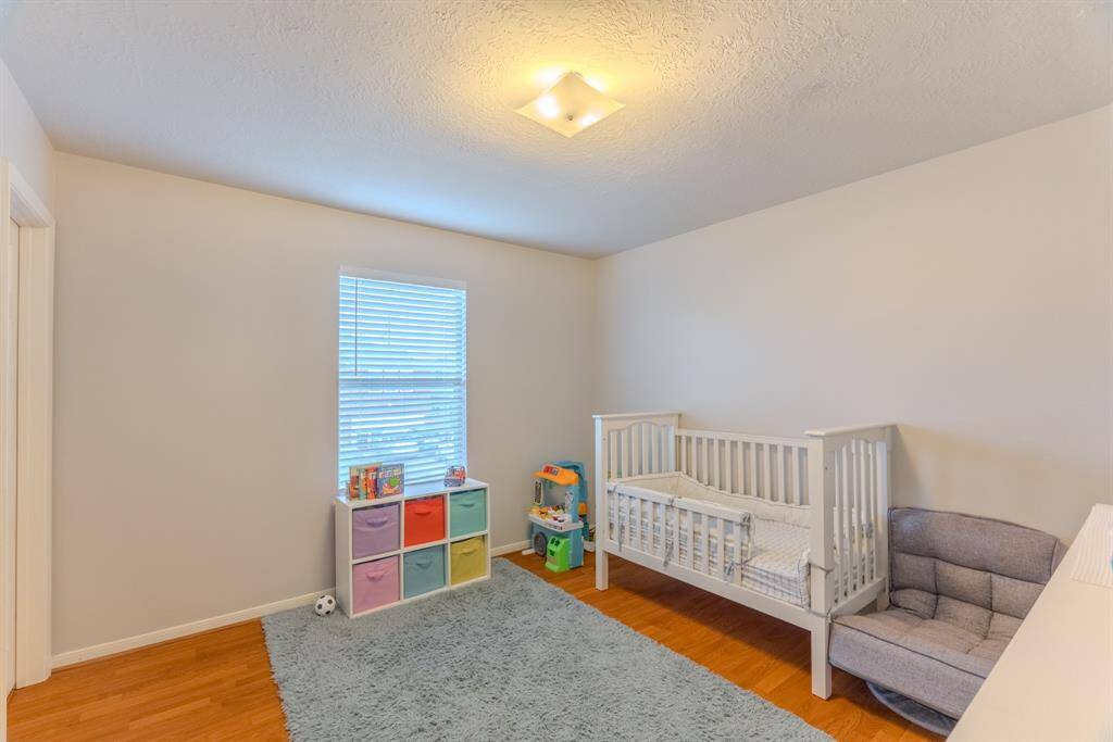 The third bedroom is cozy and bright, offering ample closet space and versatility for use as a bedroom, office, or personal retreat