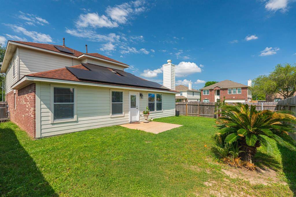 The spacious backyard on this corner lot provides ample room for outdoor entertaining, gardening, or play