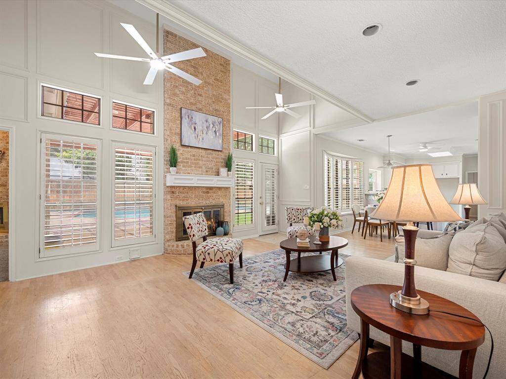 Family room filled with natural light and scenic views of the pool