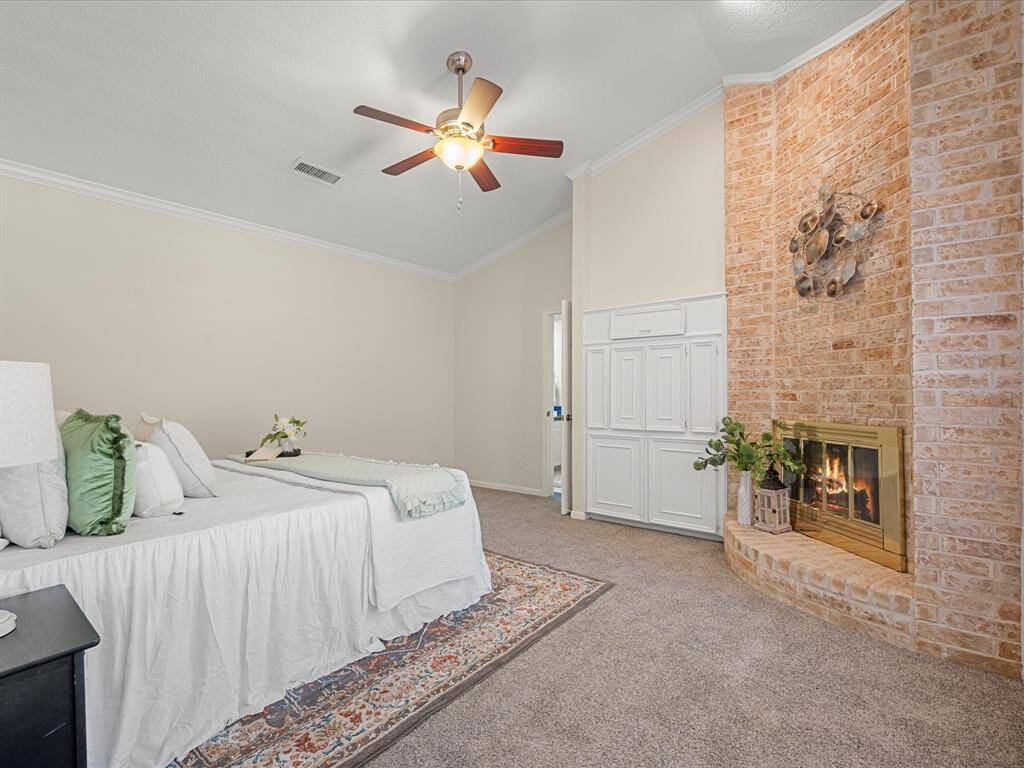 Nice primary bedroom with cozy fireplace