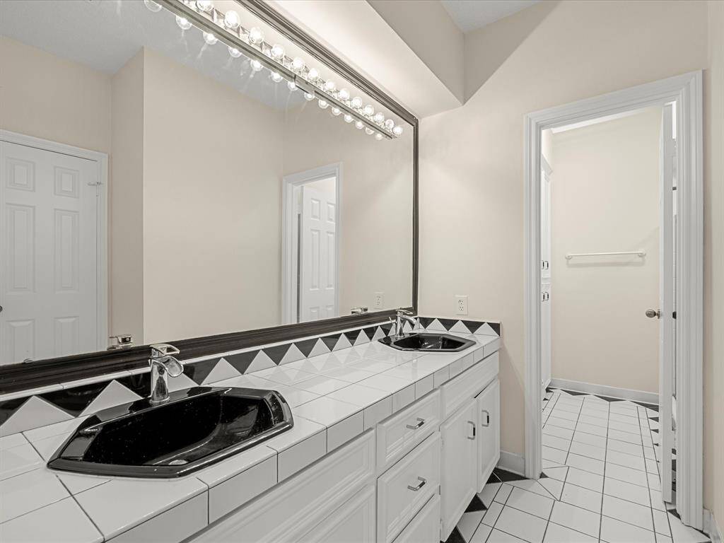 Secondary bathroom comes with double sink