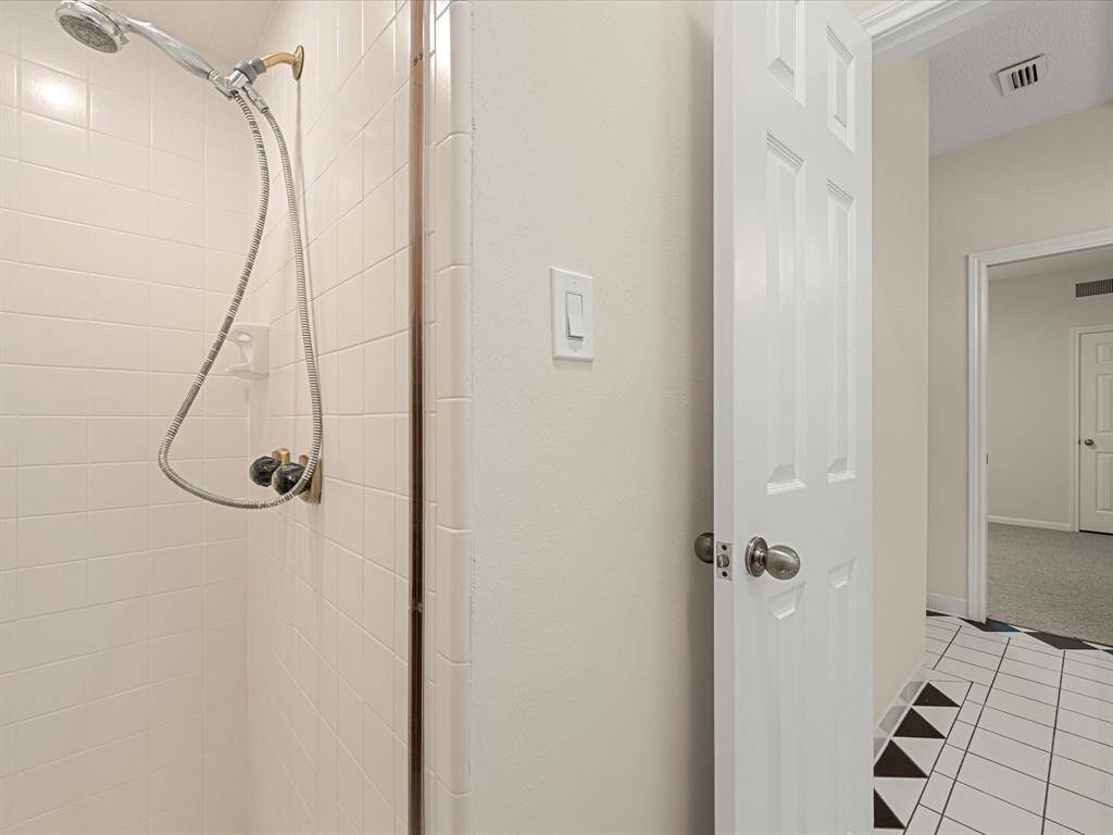Stand along shower in the secondary bathroom