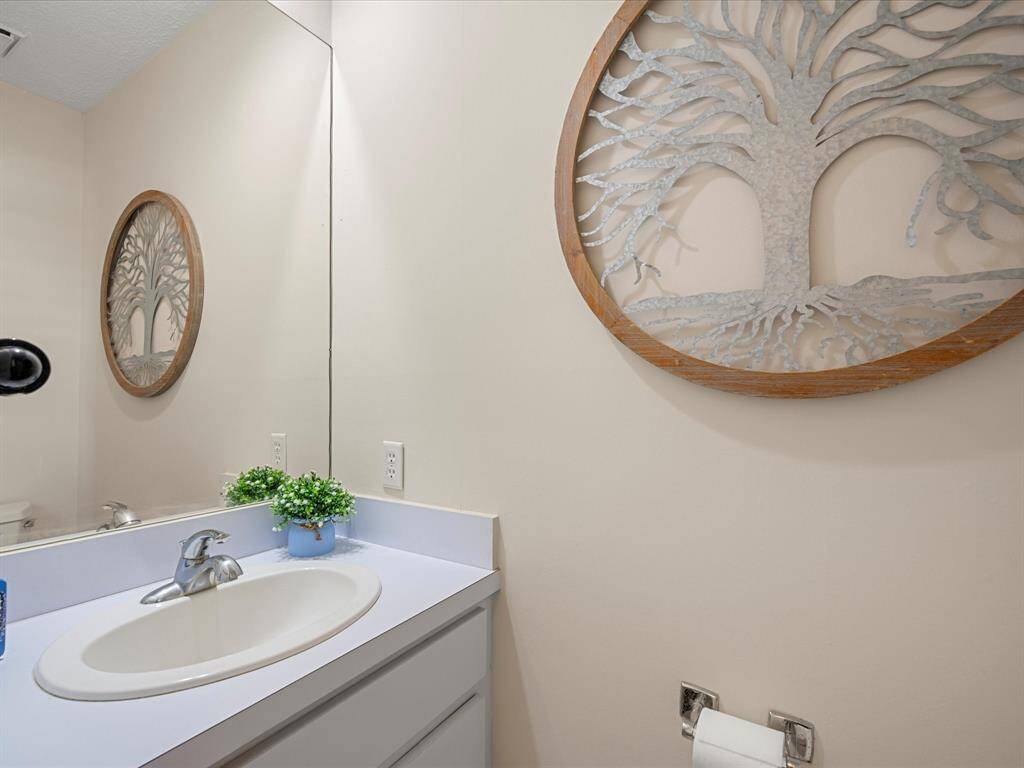Half bath downstairs provides convenience to all guests
