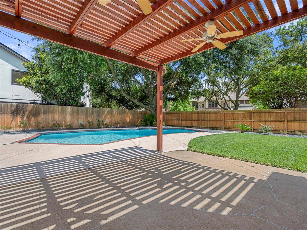 Charming pergola offers comfortable shade and a perfect space for outdoor relaxation