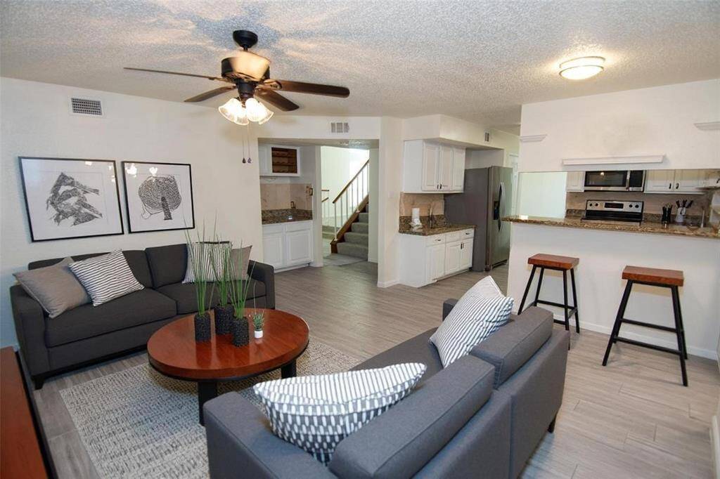 Kitchen overlooks large den Virtually staged