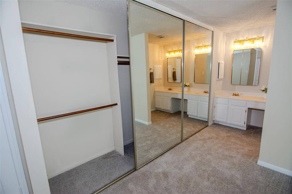 upstairs primary closet in bedroom